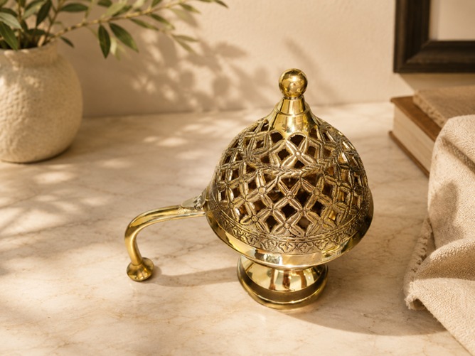 Brass bakhoor burner with intricate detailing